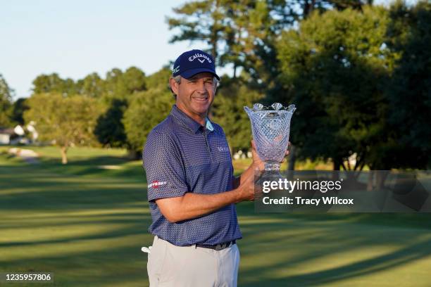 Lee Janzen holds the trophy after a playoff in the final round of the PGA TOUR Champions SAS Championship at Prestonwood Country Club on October 17,...