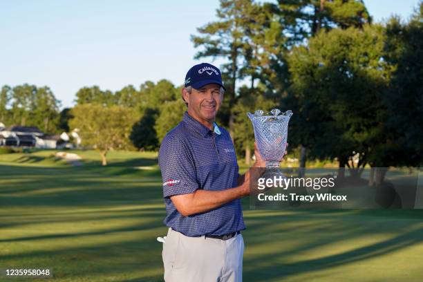 Lee Janzen holds the trophy after a playoff in the final round of the PGA TOUR Champions SAS Championship at Prestonwood Country Club on October 17,...