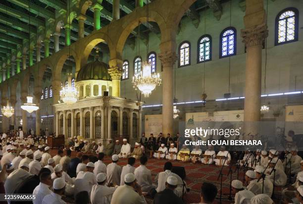 Syrians pray at the Umayyad Mosque in Damascus, on the eve of celebrations marking the birth of the Prophet Mohammed, known in Arabic as the "Mawlid...