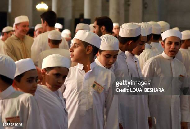 Syrians pray at the Umayyad Mosque in Damascus, on the eve of celebrations marking the birth of the Prophet Mohammed, known in Arabic as the "Mawlid...