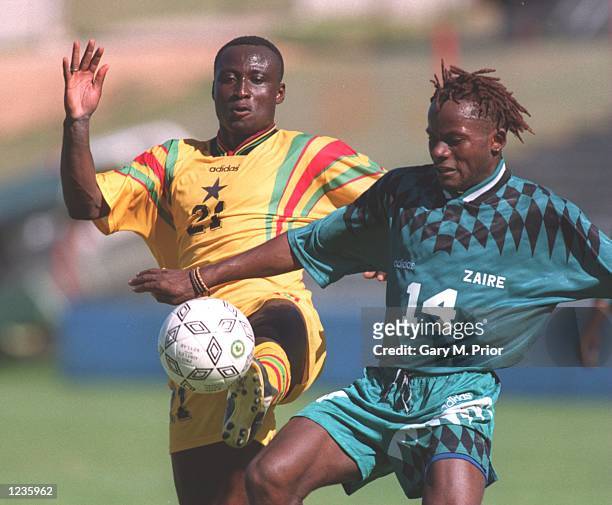 Leeds United player, Tony Yeboah, playing for Ghana and Zaire's Roger Hitoto in action during Ghana's 1-0 victory over Zaire in the Quarter Final of...