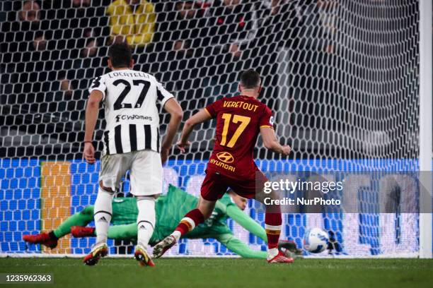 Juventus goalkeeper Wojciech Szczesny dives for the ball saving penalty kick shooted by Roma midfielder Jordan Veretout during the Serie A football...