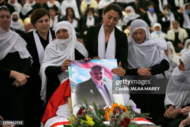 Druze women mourn their relative Medhat Saleh during his funeral in the village of Majdal Shams in the Israel-annexed Golan Heights on October 18,...