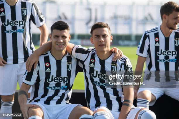 Alvaro Morata of Juventus and Paulo Dybala of Juventus during the Juventus official team photo at JTC on October 18, 2021 in Turin, Italy.