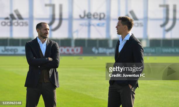 Giorgio Chiellini of Juventus and Wojciech Szczesny of Juventus during the Juventus official team photo at JTC on October 18, 2021 in Turin, Italy.