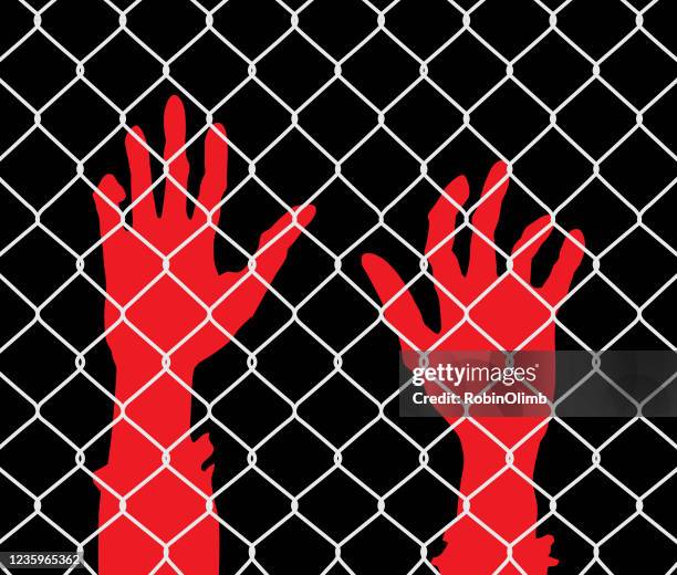 raised hands chainlink fence - monster hand reaching stock illustrations
