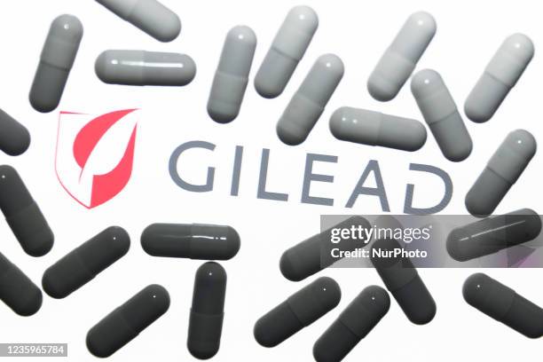 Gilead Sciences logo displayed on a laptop screen and medical pills are seen in this illustration photo taken in Krakow, Poland on October 18, 2021.