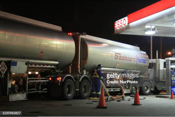 Worker transferring gasoline from a fuel tanker truck to a gasoline station in Toronto, Ontario, Canada, on September 11, 2008.