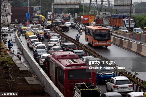 Heavy traffic at Ghazipur flyover and underpass due to overnight rain on October 18, 2021 in New Delhi, India. According to data shared by the India...