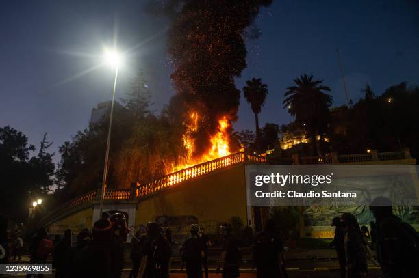 Demonstrators clash with riot police near to La Moneda Presidential Palace on October 18, 2021 in Santiago, Chile. On October 18 an increase in the...