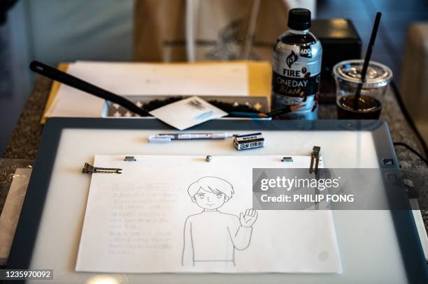 This picture taken on June 17, 2021 shows a student desk at the anime school Sasayuri in Tokyo. - Japan is facing a shortage of skilled animators, in...