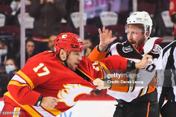 Milan Lucic of the Calgary Flames fights Nicolas Deslauriers of the Anaheim Ducks during an NHL game at Scotiabank Saddledome on October 18, 2021 in...