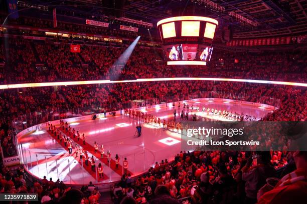General view of the arena as fans and players stand for the national anthems ahead of an NHL game where the Calgary Flames hosted the Anaheim Ducks...