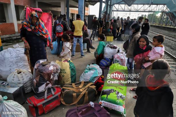 Indian migrant workers are seen inside at a railway platform to board trains as they leave for their home states following attacks on migrant...