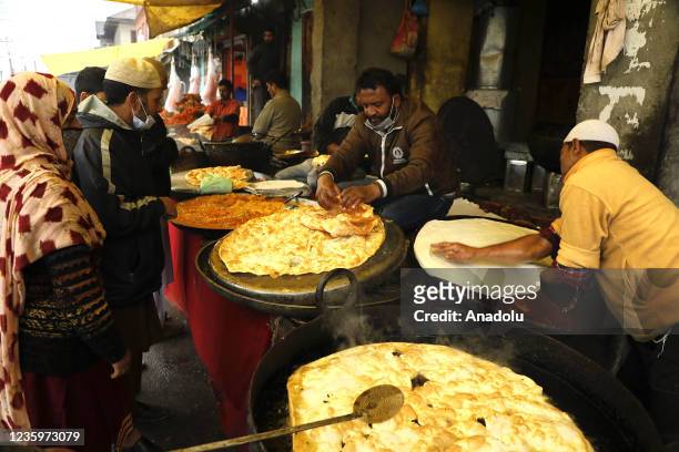 Street vendors prepare snacks on the occasion of celebration of Mawlid al-Nabi or Prophet Muhammad's birth anniversary in Dargah Hazratbal shrine in...