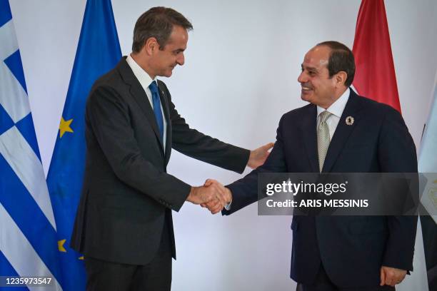 Greece's Prime Minister Kyriakos Mitsotakis welcomes Egypt's President Abdel Fattah El-Sisi ahead of a trilateral meeting between Greece, Egypt and...