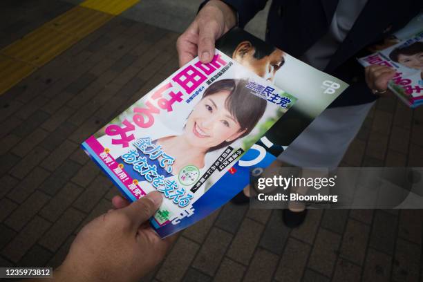 Supporter receives flyers for Yukio Edano, head of the Constitutional Democratic Party of Japan, and Harumi Yoshida, a party's member running in the...