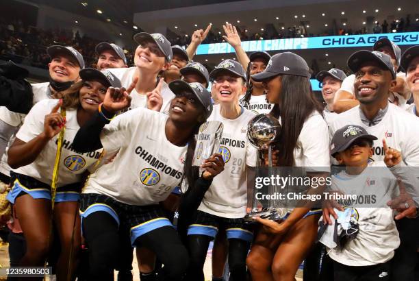 Chicago Sky players, including Chicago Sky MVP Kahleah Copper , second from left, celebrate after winning the WNBA championship, 80-74, against the...