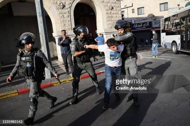 Israeli police arrest a Palestinian at Damascus Gate as Palestinian Muslims stage a march to mark the day of Mawlid al-Nabi in Old City, East...