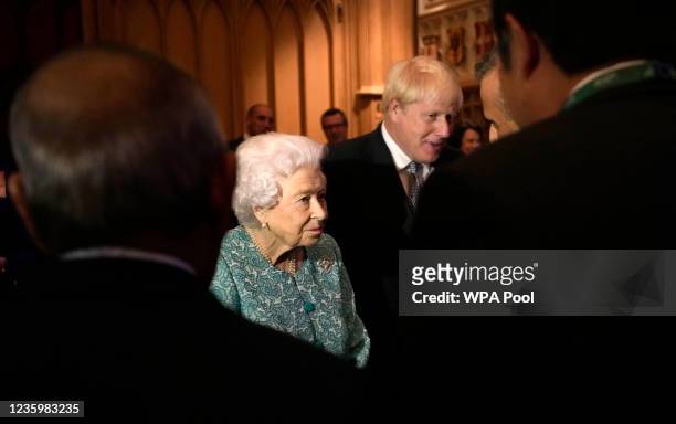 Queen Elizabeth II and Prime Minister Boris Johnson greet guests at a reception for the Global Investment Summit at Windsor Castle on October 19,...
