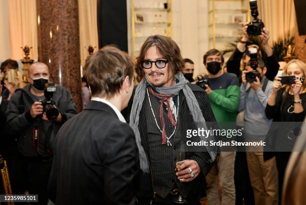 Actor Johnny Depp and Serbian Prime Minister Ana Brnabic attend promotion of the animated series "Puffins" in Belgrade on October 19, 2021.