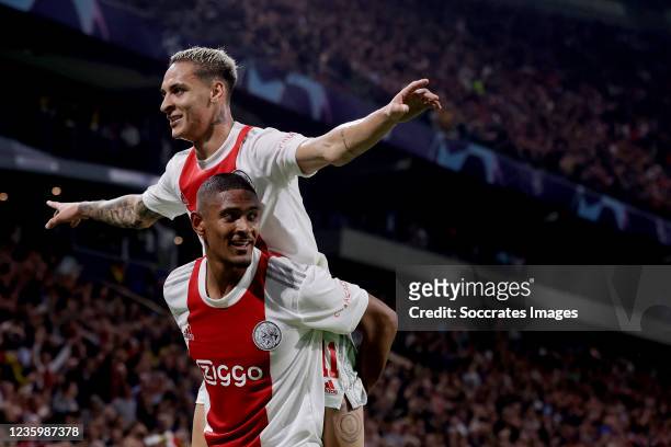 Sebastien Haller of Ajax celebrates 4-0 with Antony of Ajax during the UEFA Champions League match between Ajax v Borussia Dortmund at the Johan...