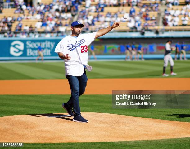 Former Dodgers player Adrian Gonzalez throws out the ceremonial first pitch before Game 3 of the NLCS between the Atlanta Braves and the Los Angeles...