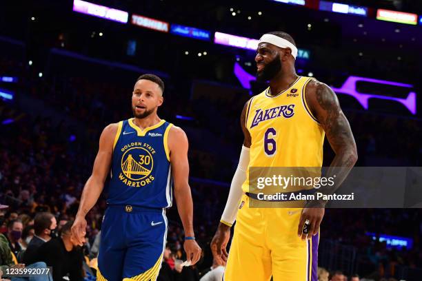 Stephen Curry of the Golden State Warriors and LeBron James of the Los Angeles Lakers talk during the game on October 19, 2021 at STAPLES Center in...