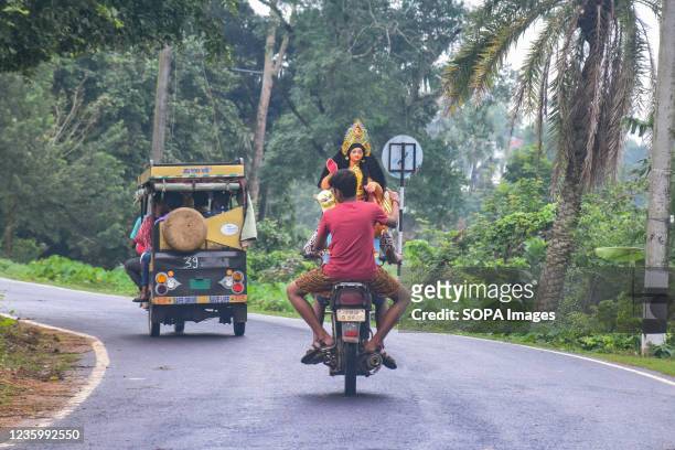 Devotees are seen carrying laxmi idol on a motorbike. Kojagari Puja, also known as Bengal Laxmi Puja. Kojagari Puja is carried out on a full moon day...