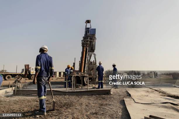 Local labourers work at the Renergen Gas Project drilling site in Virginia, Free State, on September 22, 2021. In a grassy plain in South Africa,...