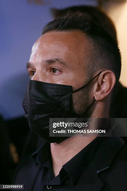 France's football player Mathieu Valbuena, involved in a 'sex tape case', addresses media representatives inside a court at the end of the hearing in...