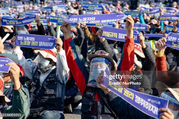 Thousands of the Korean Confederation of Trade Unions members march to Seoul City hall during a rally against the government's labor policy on...