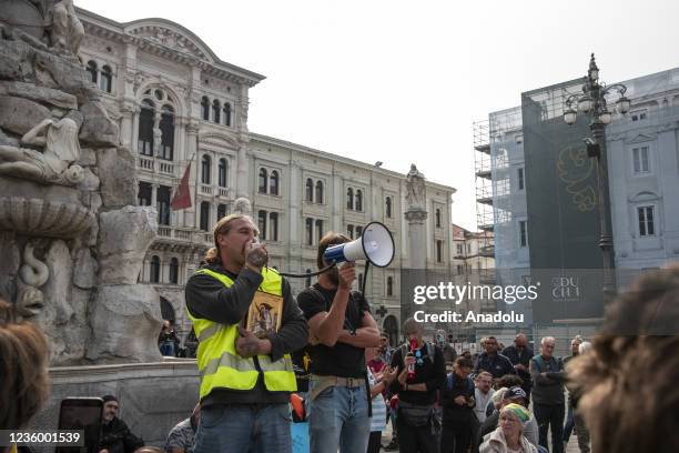 People demonstrate against the implementation of COVID-19 health pass, the Green Pass at the Unity of Italy Square in Trieste, Italy, on October 20,...