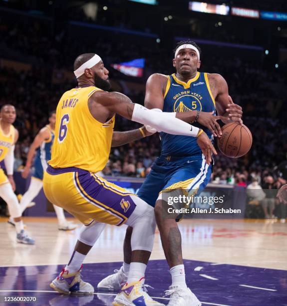 Los Angeles, CA Los Angeles Lakers forward LeBron James knocks the ball away from Golden State Warriors forward Kevon Looney in the second half of...