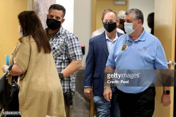Jennifer and Tony Montalto, the parents of slain student Gina Montalto, and Fred Guttenberg, the father of slain student Jaime Guttenberg, arrive at...