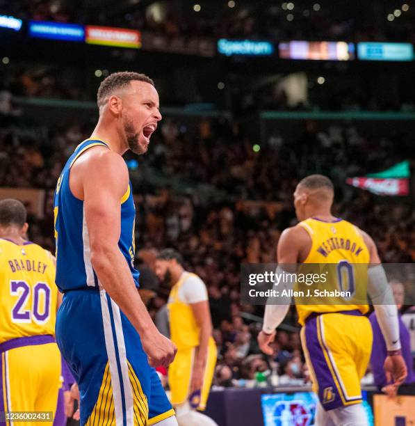 Los Angeles, CA Golden State Warriors guard Stephen Curry, who had 21 points, 10 assists, celebrates as new Los Angeles Lakers guard Russell...