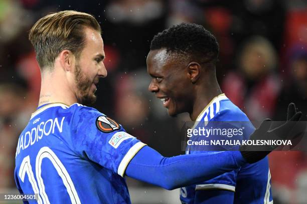 Leicester City's Zambian striker Patson Daka celebrates with Leicester City's English midfielder James Maddison after scoring the team's fourth goal...