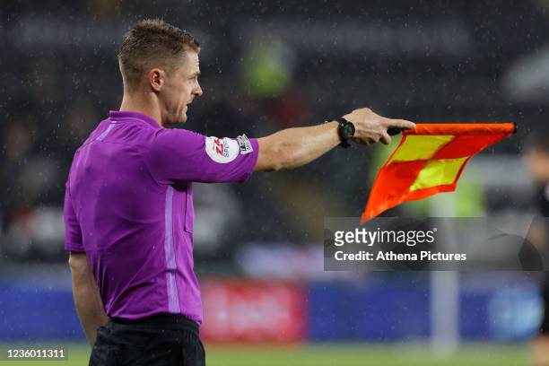 Assistant referee Daniel Robathan awards an off-side to West Bromwich Albion during the Sky Bet Championship match between Swansea City and West...