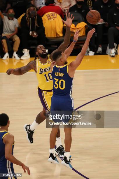 Golden State Warriors guard Stephen Curry shoots before Los Angeles Lakers center DeAndre Jordan can block his shot during the Golden State Warriors...
