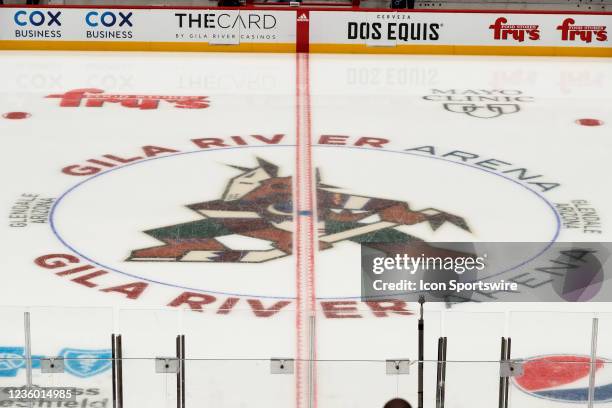 The Arizona Coyotes kachina logo at center ice before the NHL hockey game between the St. Louis Blues and the Arizona Coyotes on October 18, 2021 at...