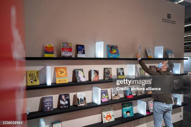 October 2021, Hessen, Frankfurt/Main: A man stands in the Spanish pavilion on the second day for trade visitors at the Frankfurt Book Fair 2021....