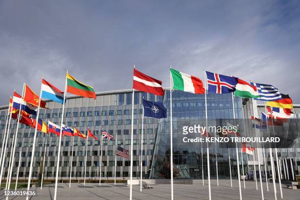 Picture shows the flags of countries members of the North Atlantic Treaty Organization , with the US flag at half mast in honour to late US State...
