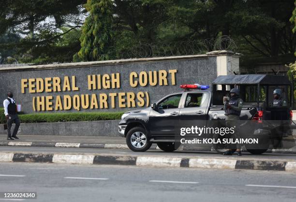 Men of the Nigeria police force are seen outside the Federal High Court, during the trial of leader of the Proscribed Indigenous People of Biafra ,...