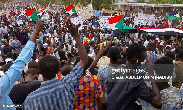 Sudanese demonstrators march in the streets of Nyala, the capital of South Darfur, to demand the government's transition to civilian rule, on October...