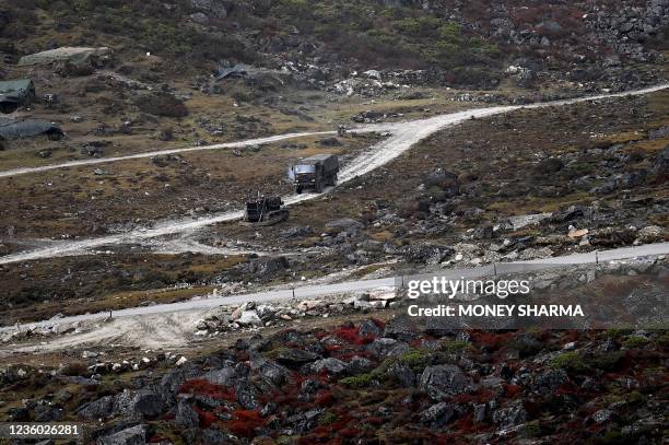 An Indian Army truck drives along a road to Tawang, near the Line of Actual Control , neighbouring China, near Sela Pass in India's Arunachal Pradesh...