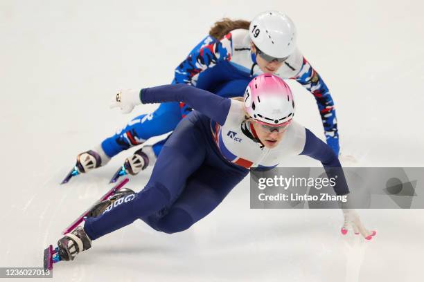 Elise Christie of Great Britain and Evgeniya Zakharova of Russia compete in the Women's 500m Preliminaries during the day one of 2021/2022 ISU World...