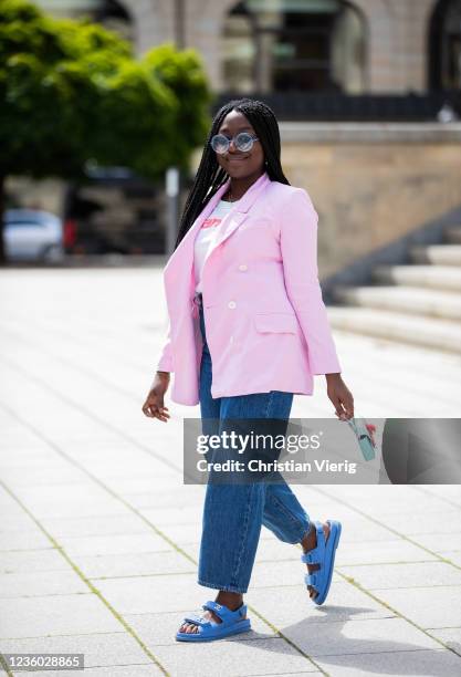 Lois Opoku is seen wearing pink blazer Zara, white tshirt Wangler, Levis denim jeans, sunglasses Fendi, blue Chanel sandals, mini bag Fendi on May...