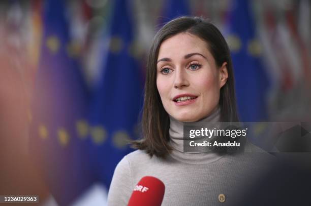 Finnish Prime Minister Sanna Marin speaks to press members as she arrives for the first day of EU Leaders' Summit in Brussels, Belgium on October 21,...