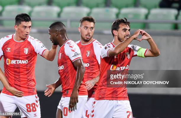 Sporting Braga's Portuguese midfielder Ricardo Horta celebrates with teammates after he scored his team's first goal during the UEFA Europa League...