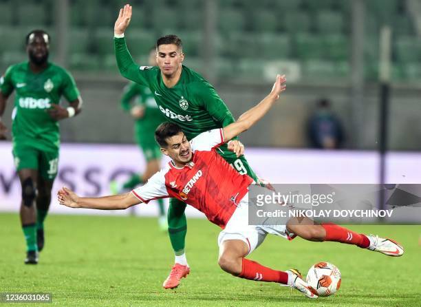Sporting Braga's Portuguese defender Diogo Leite is tackled by Ludogorets Razgrad's Cypriot forward Pieros Sotiriou during the UEFA Europa League...